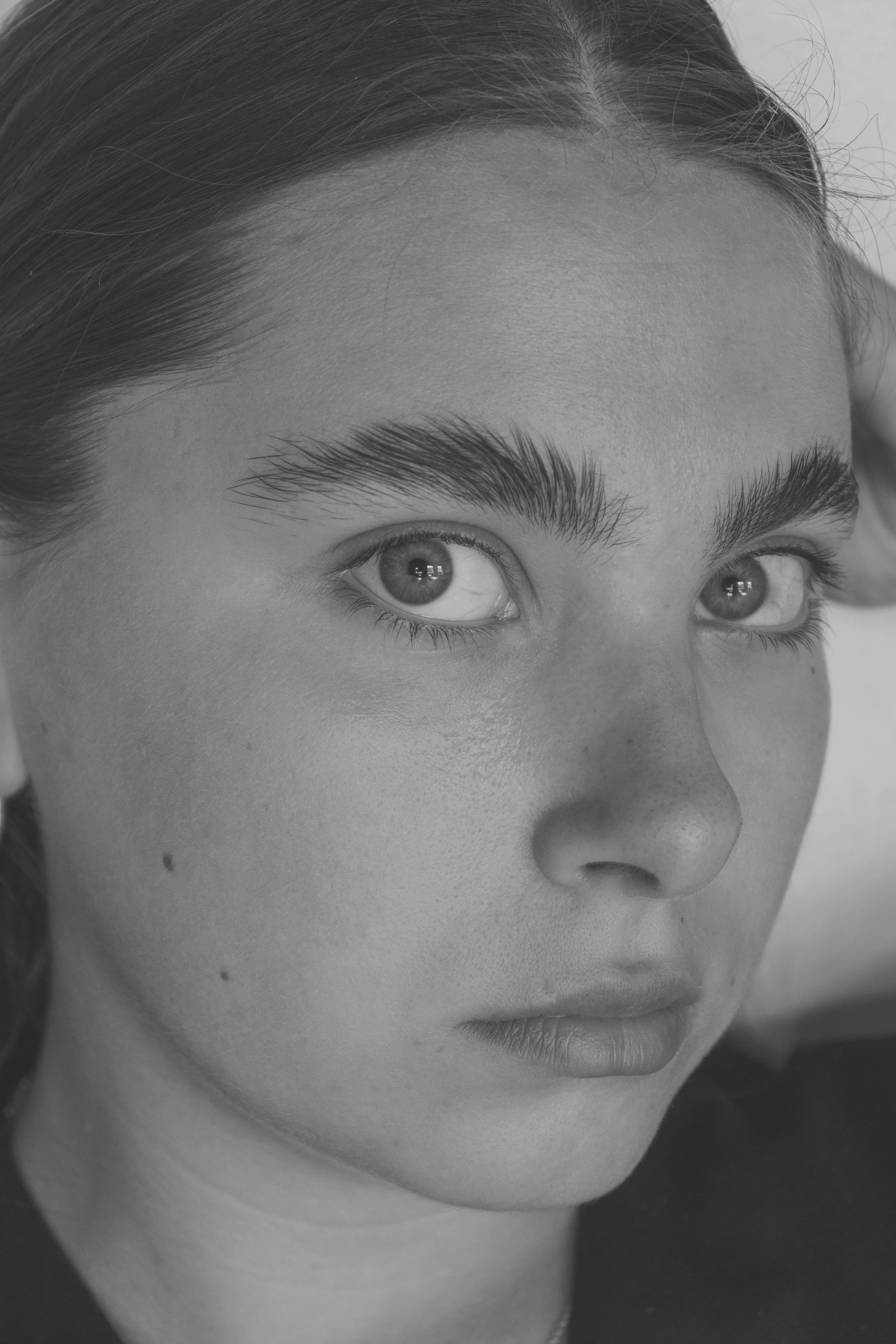 Close-up portrait of young woman with intense gaze